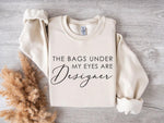 The Bags Under My Eyes Are Designer Tee The Bags Under My Eyes Are Designer Tee vendor-unknown